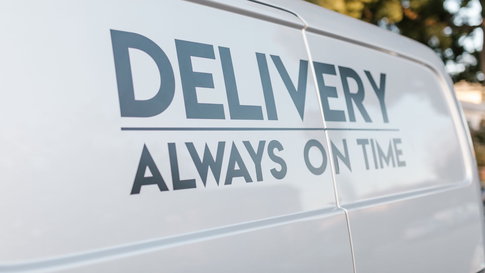 A delivery truck parked on the side of the road